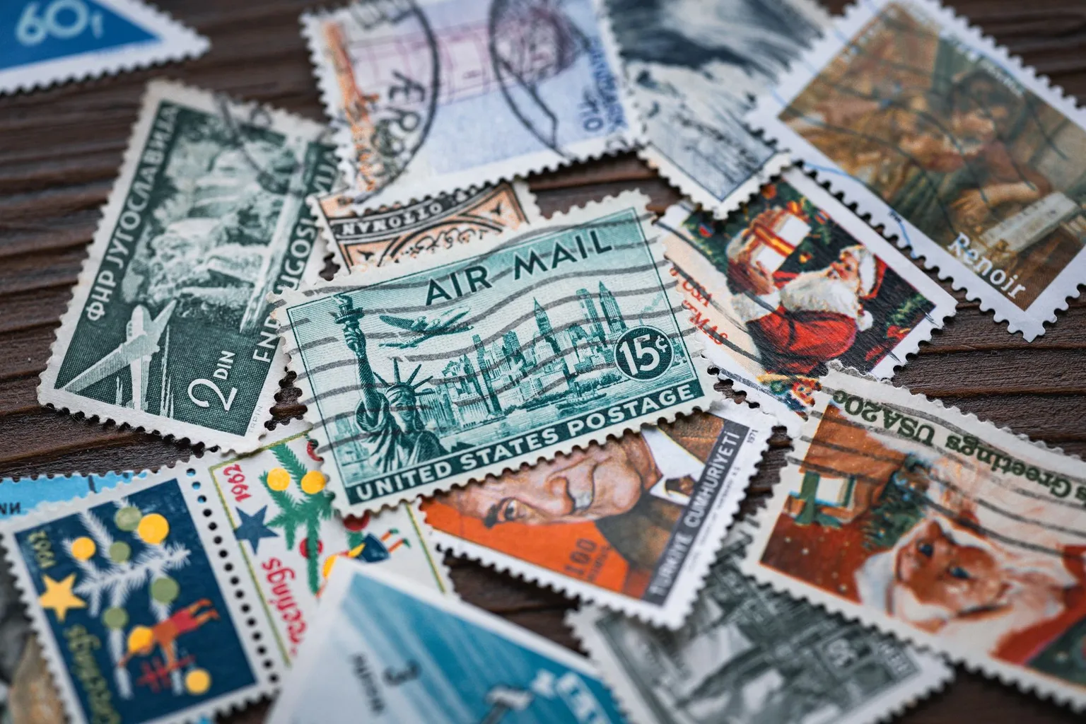 Close-up of colorful vintage postage stamps with visible cancellations