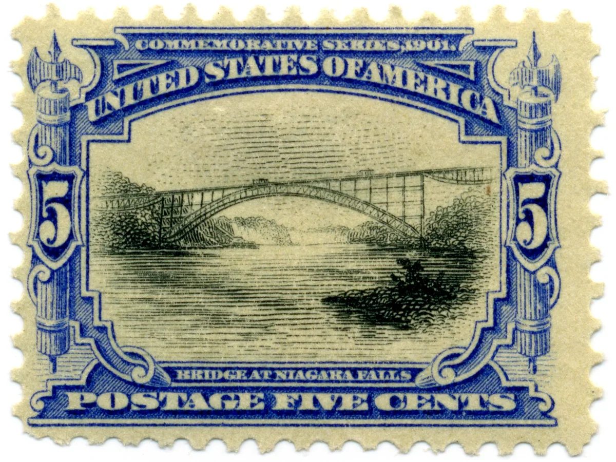 Genuine scan of the 1901 United States 5-cent Pan-American stamp, with a blue frame, upright black bridge scene and perforated edges