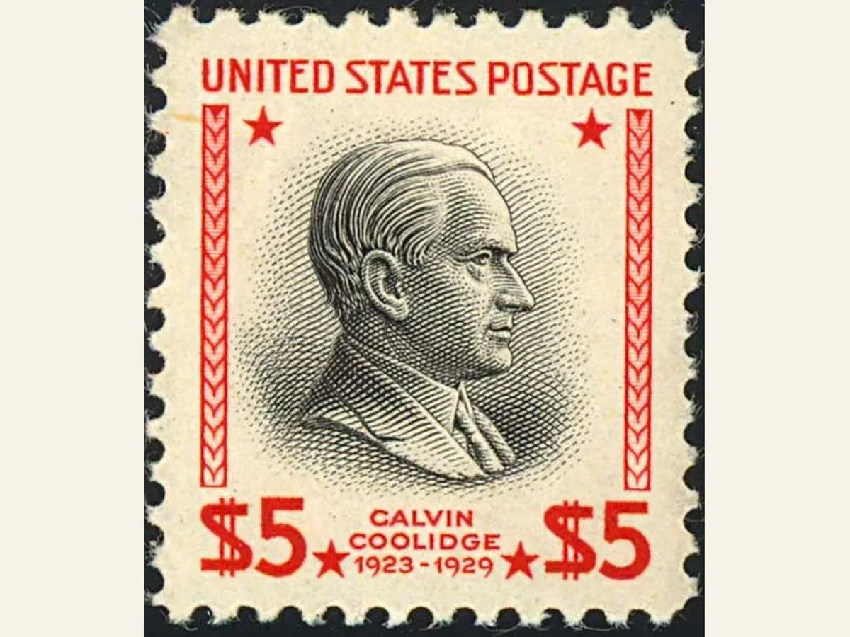 Actual 1938 five-dollar Calvin Coolidge stamp with red frame and black portrait