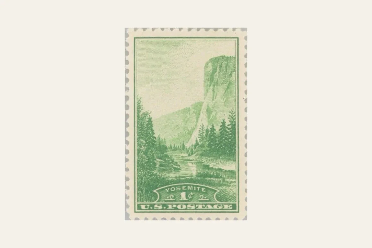 Genuine NPS reference scan of the green one-cent Yosemite stamp showing El Capitan and perforated edges
