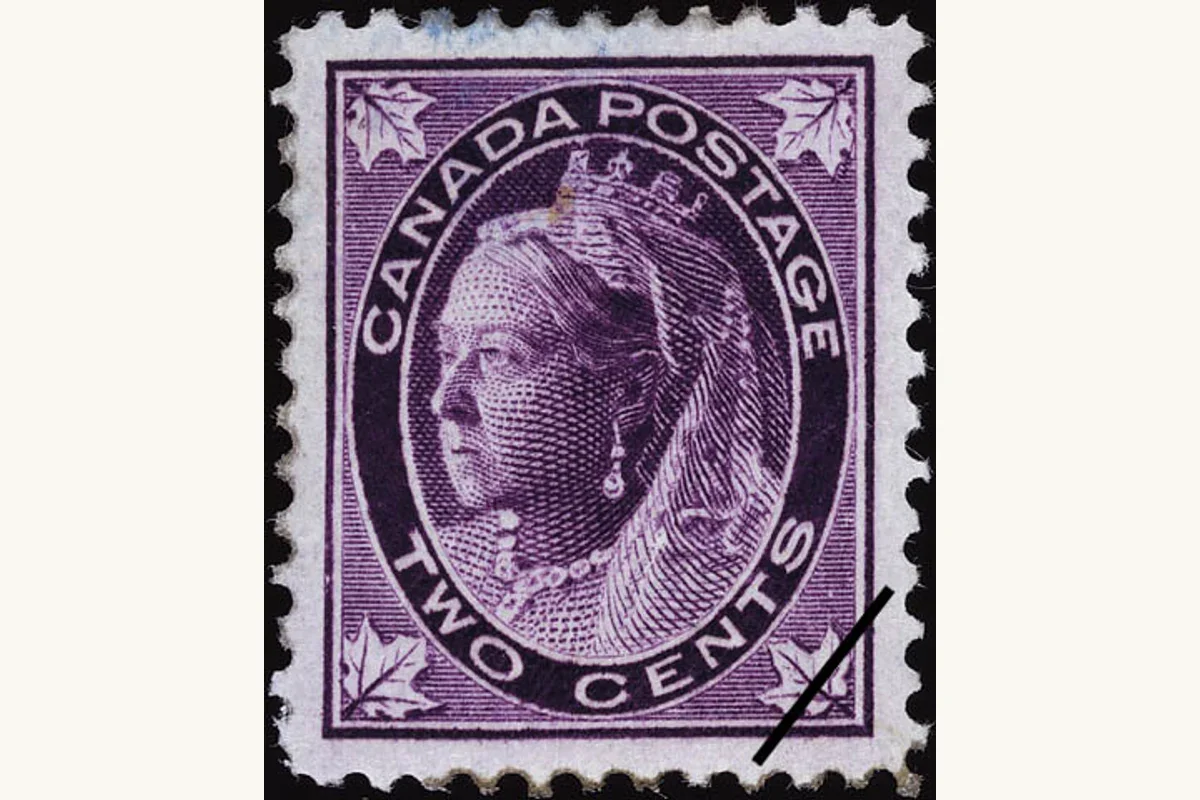 Genuine purple Canadian 2-cent Victoria Maple Leaf stamp with leaves in the lower corners and a diagonal dark mark