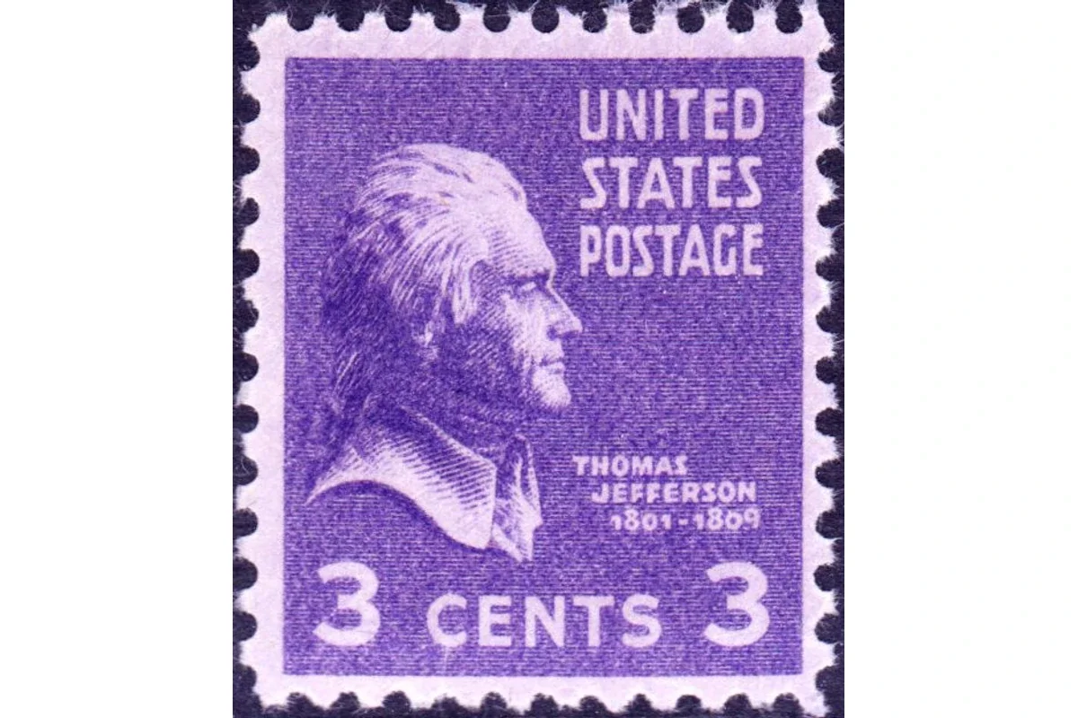 Genuine violet United States three-cent Thomas Jefferson Presidential stamp with right-facing profile and perforations on all four edges