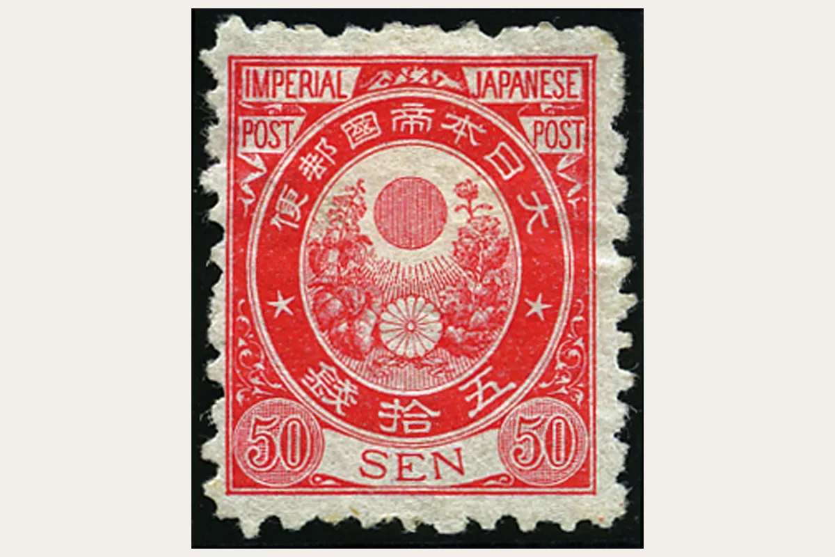 Diseño rojo de 50 sen de la familia Koban de Japón, con marco ovalado y todos los bordes dentados visibles.