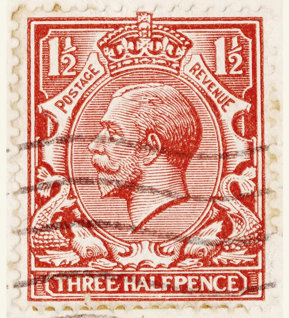 Genuine scan of a used British George V three-halfpence profile stamp with dolphin frame and dark cancellation